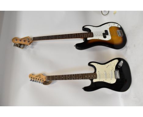 TANGLEWOOD; an electric guitar and a bass guitar (2).