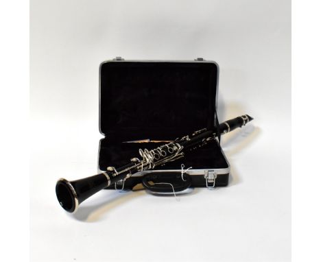 J MICHAEL; a cased clarinet.