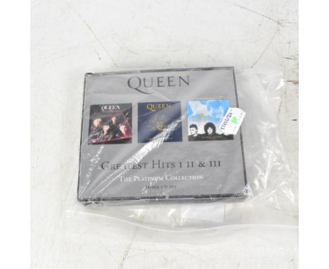 QUEEN; a Greatest Hits CD bearing three signatures to the booklet.We have not authenticated these signatures, please satisfy 