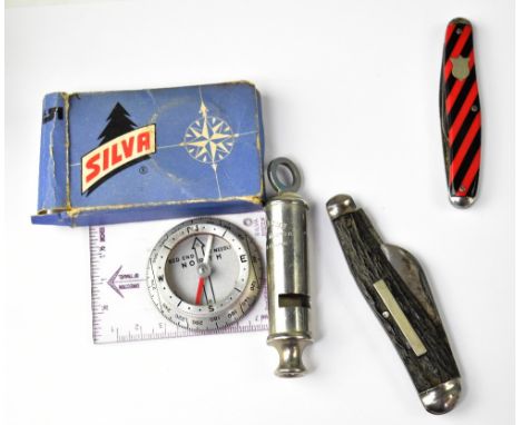 The Acme Scoutmaster whistle, two pocket knives, and a pocket compass (4).