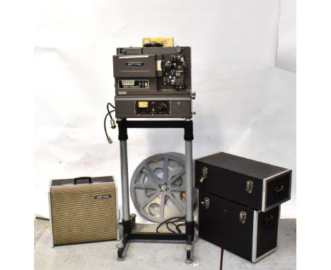 A vintage Elf-lite 16mm Xenon Arc projector with additional rewinding motor and speaker, on stand, with a small collection of