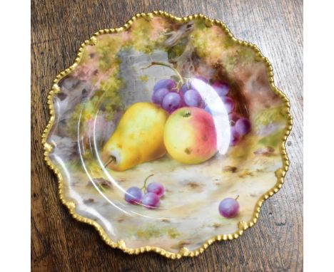 FRANK ROBERTS FOR ROYAL WORCESTER; a hand painted cabinet plate depicting pears and grapes, with gilt-heightened beaded rim, 