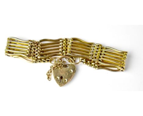 A 9ct gold six bar gate bracelet united with a 9ct gold heart-shaped padlock clasp, length approx 15cm, approx 27g.