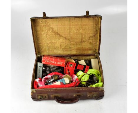 A small vintage brown leather briefcase containing a quantity of loose and boxed radio valves, to include Marconi, Radiotron,