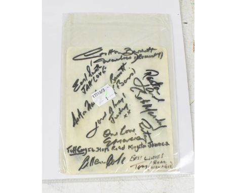 BOB MARLEY AND THE WAILERS; a single sheet torn from a scrapbook, bearing the band's signatures, including that of Bob Marley