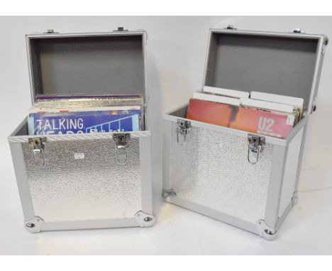 Two alloy flight cases containing a quantity of vinyl LPs to include Talking Heads, 'Slippery People', Tear For Fears, 10CC, 