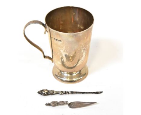 A George V hallmarked silver footed mug, Vale &amp; Charles, Birmingham 1945, a hallmarked silver bookmark in the form of a t