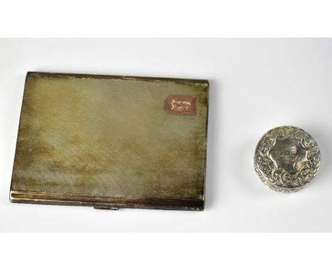 An Art Deco hallmarked silver cigarette case with engine turned decoration and inset gold panel with the initials 'LEH', 11.5