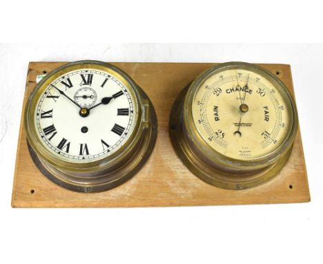 A brass cased porthole clock, the white enamelled dial set with Roman numerals and subsidiary seconds hand, mounted to a plin