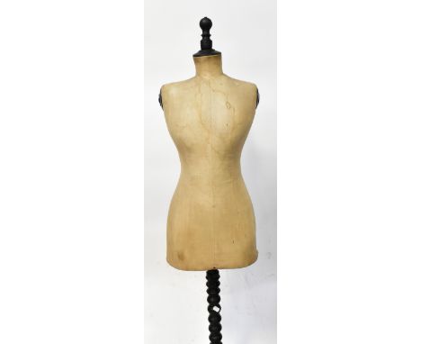 An early 20th century French dressmaker's mannequin, faded marks to the bottom, numbered 50115 and 'Paris', to an adjustable 