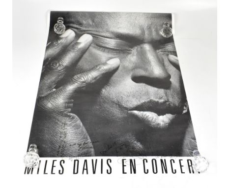 MILES DAVIS; a black and white poster bearing his signature, along with that of the Japanese photographer who took the photog