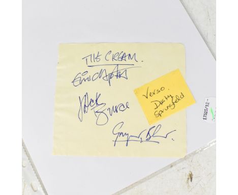 THE CREAM; a page from an autograph book bearing the signature's of Eric Clapton, Jack Bruce and Ginger Baxter to the front, 