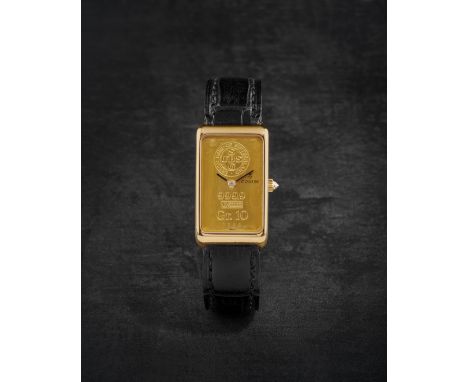 CORUM. MONTRE BRACELET EN OR JAUNE 18K (750) DE FORME RECTANGULAIRE AVEC CADRAN LINGOT MOUVEMENT MECANIQUECORUM. AN 18K GOLD 
