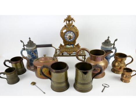 Gilt metal mantel clock, two steins and a collection of metal ware 