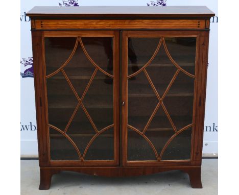 Mahogany and satinwood line inlaid with glazed doors on bracket feet,