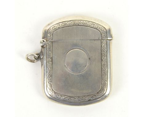 Large silver vesta case with engine turned finish and scrolled border with vacant cartouche, Birmingham 1912