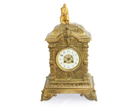 A brass mantel clock,late 19th century, French, surmounted by a gilt Classical style scholar, the enamel dial with Arabic num