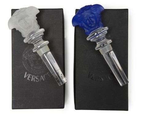 A pair of Versace Medusa wine bottle stoppers by Rosenthal , with a frosted and blue glass moulded medusa double head, above 