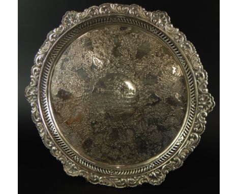 A late Victorian silver salver, with shell leaf cast pierced border, engraved centrally with flowers, folic scrolls, etc., pr