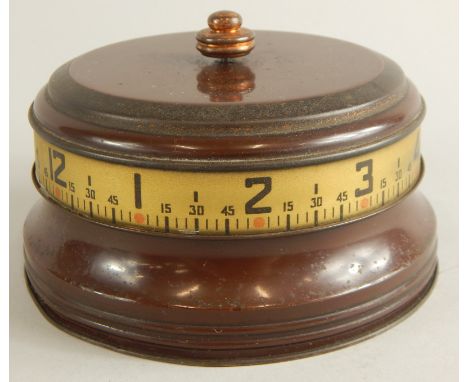 An American table clock, in brown painted metal case, 12cm dia.