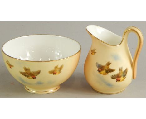 Two items of Royal Worcester Grainger & Co porcelain, comprising a milk jug and sugar bowl, each decorated with birds, the bo