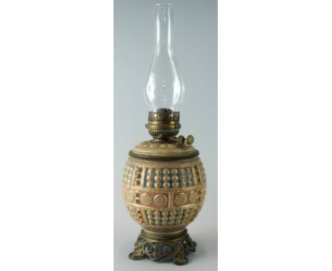 A late 19thC pottery oil lamp by Fischer of Budapest, decorated with Islamic style roundels in the manner of Zsolnay, the fit