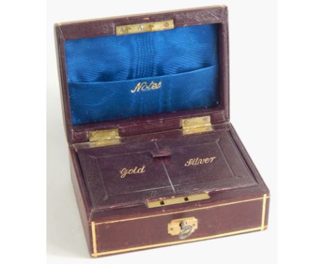 A burgundy leather travelling jewellery box, the domed lid part stencilled and worked to reveal a section for notes, lift up 