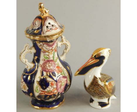 Two items of ceramics, a Royal Crown Derby brown porcelain pelican, with gold button and a Mason's Ironstone Penang pattern t