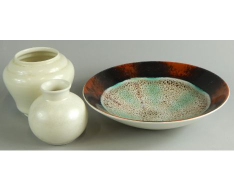 Various items of Poole pottery, to include a bowl with psychedelic decoration and two white glazed vases.