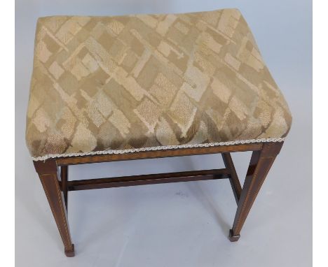 An Edwardian and mahogany satinwood crossbanded stool, with a padded seat, square tapering legs and 'H' stretcher, 48cm wide.