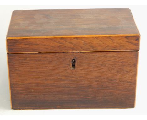 A plain Victorian rosewood rectangular tea caddy, the hinged lid enclosing two divisions, 19cm wide.