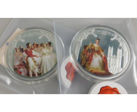 Two silver coloured Windsor Mint coins, made to commemorate the 175th anniversary of Queen Victoria and another similar