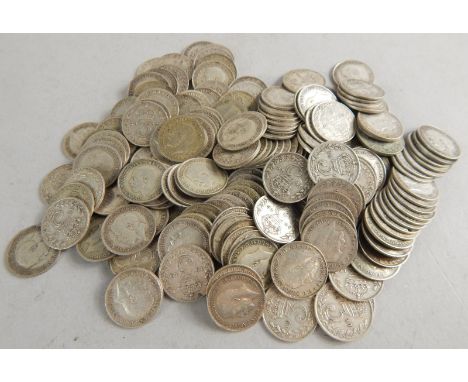 A large collection of silver threepenny bits, etc.