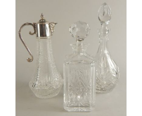 A claret jug, with silver plated mount, and two decanters and stoppers.