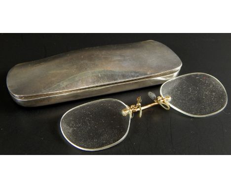 A set of pince-nez spectacles, in a silver case hallmarked for Birmingham 1902.