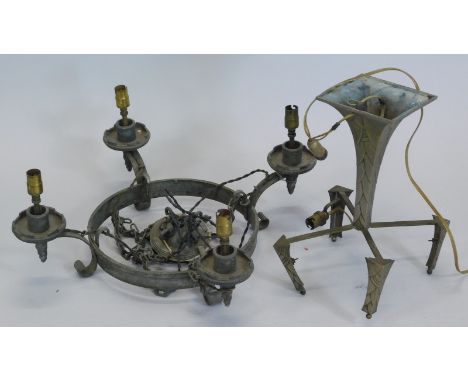 An early Art Deco style silvered lamp base, lacking shade, and a wrought iron five branch chandelier.