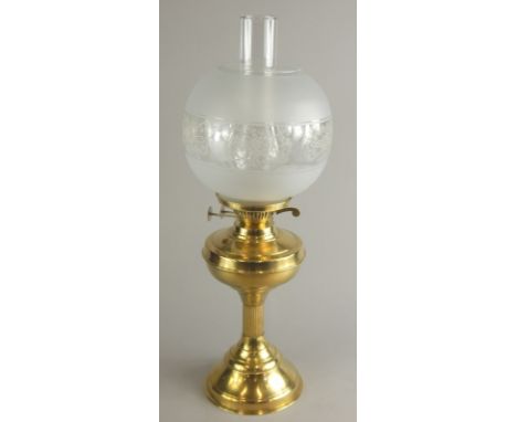 A late 20thC brass oil lamp, with frosted etched type shade, 55cm high.