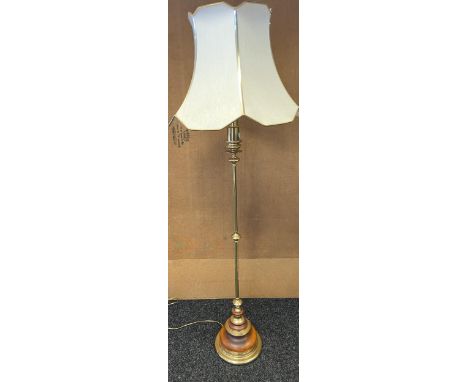 A Brass and wood floor standing lamp. [working] 