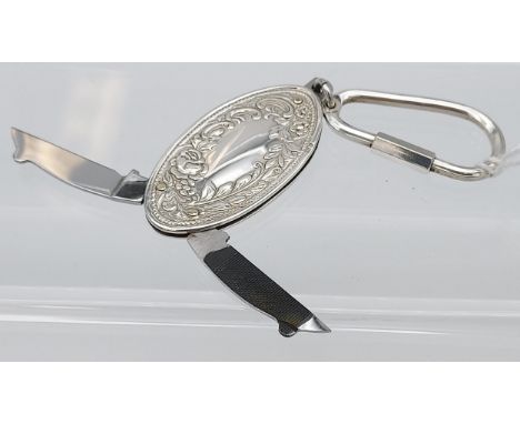 A London silver key ring with fruit knife and manicure item attached. [26.33grams] 
