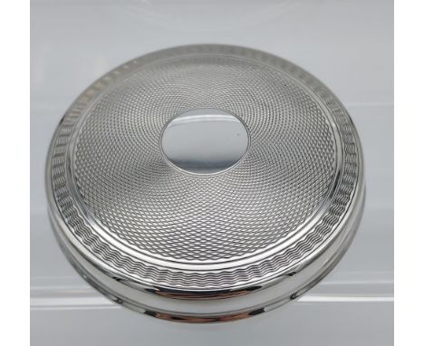 A Birmingham silver compact case. [82.25grams] 