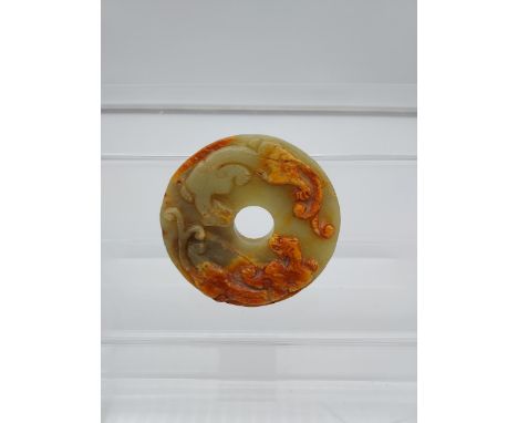 A Chinese Jade/ hardstone hand carved large disc detailed with Pumas [8.5cm in diameter] 