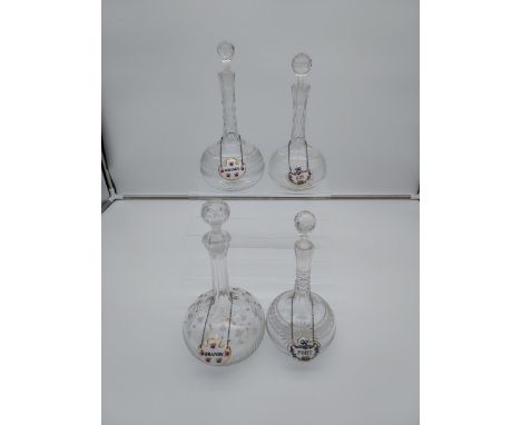 A Lot of four various antique facet cut long neck crystal decanters all with ceramic drinks labels. [29cm in height] 