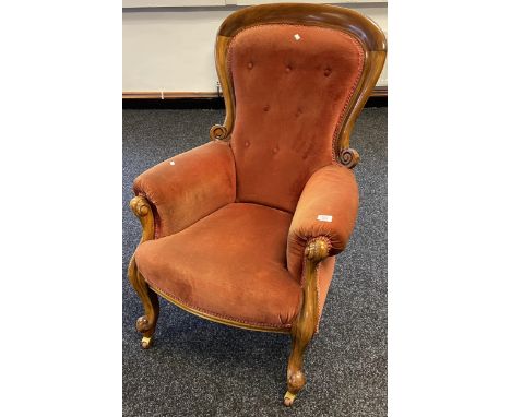 A 19th century button back parlour chair. Supported on carved legs and Reilly's Patent brass and ceramic castors. 