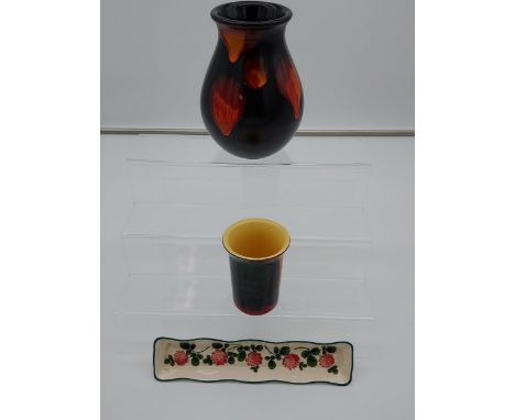 Two Poole pottery vases, together with a Wemyss G.Hill pen tray 