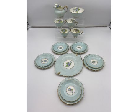 A Vintage part Paragon tea set detailing various flowers [24 pieces] and sky blue ground. 