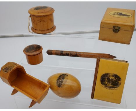 A Selection of Mauchline ware to include cradle, wood work pencil, Calendar book and trinket boxes 