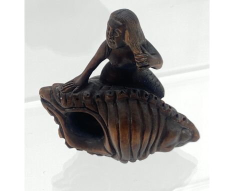 A Hand carved Japanese netsuke of a mermaid on a shell. Signed. 