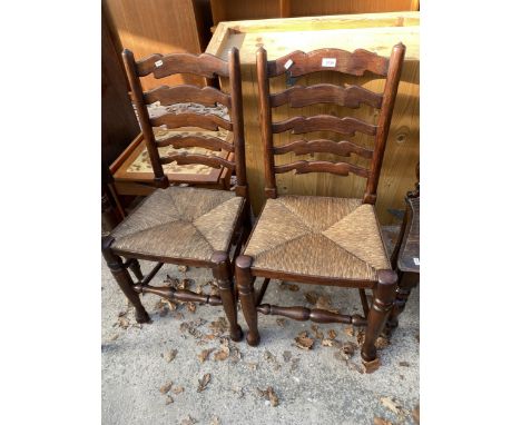 A PAIR OF LANCASHIRE STYLE RUSH SEATED LADDER BACK DINING CHAIRS
