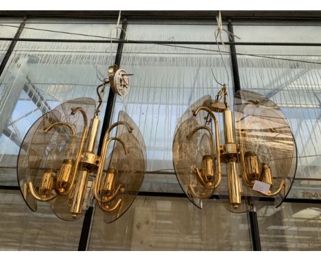 A PAIR OF RETRO GILT AND SMOKED GLASS CEILING LIGHT FITTINGS