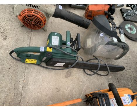 THREE ITEMS TO INCLUDE TWO CHAINSAW MASKS ONE BEING A STIHL AND A ELECTRIC CHAINSAW